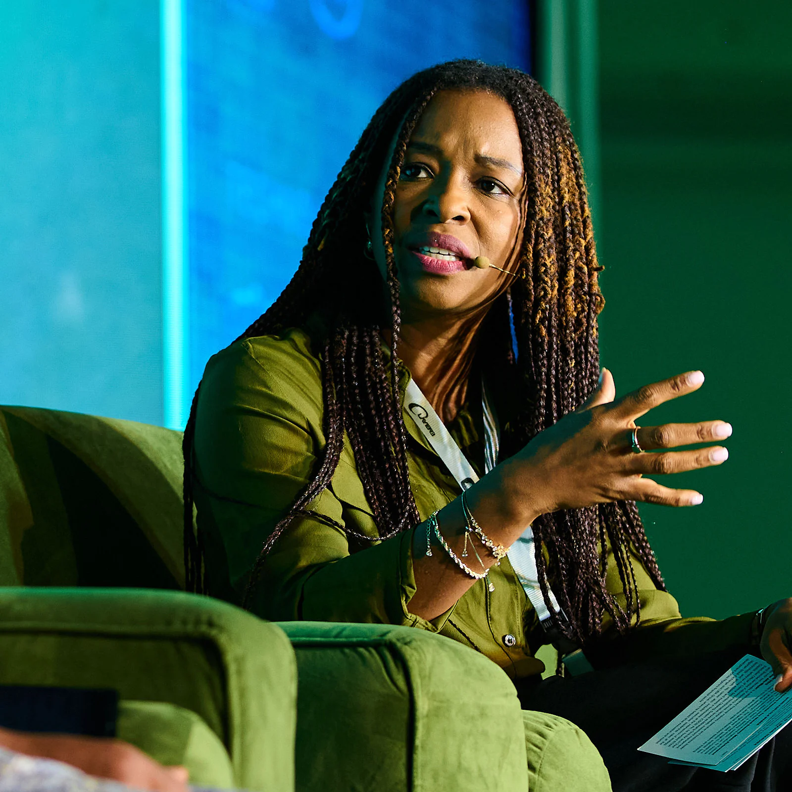 Lola Masha speaking during a panel conversation on stage